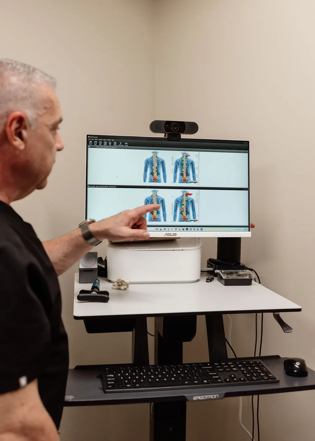 Dr. Ron Federico reviewing spine imaging