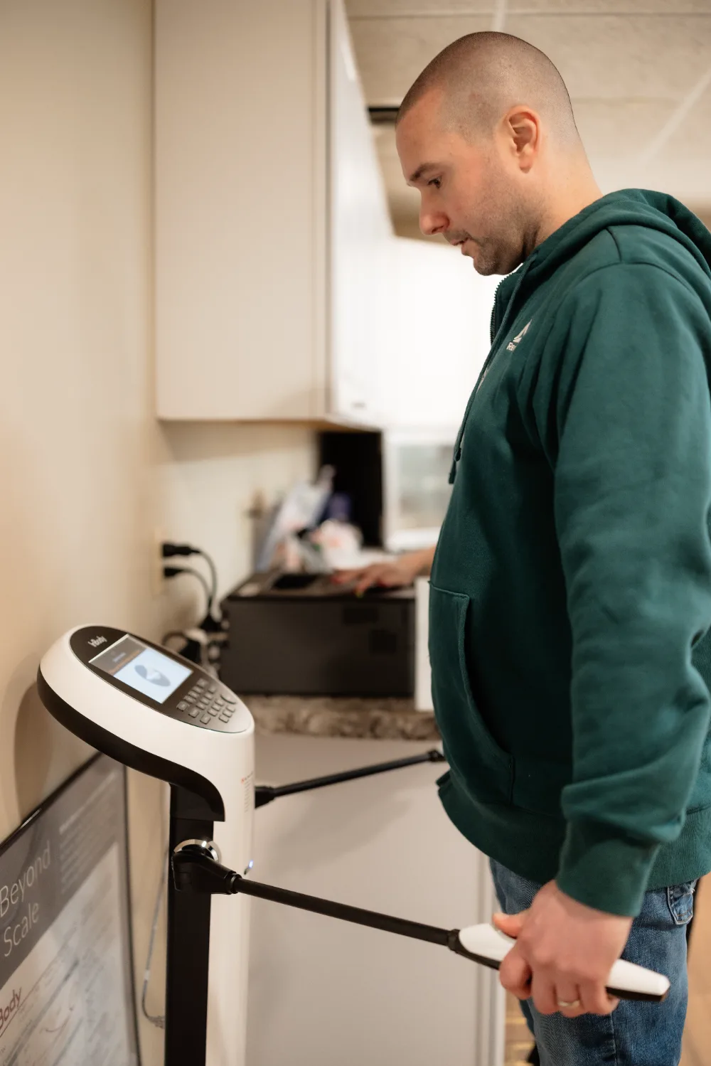 Patient stepping on the InBody body composition scanner
