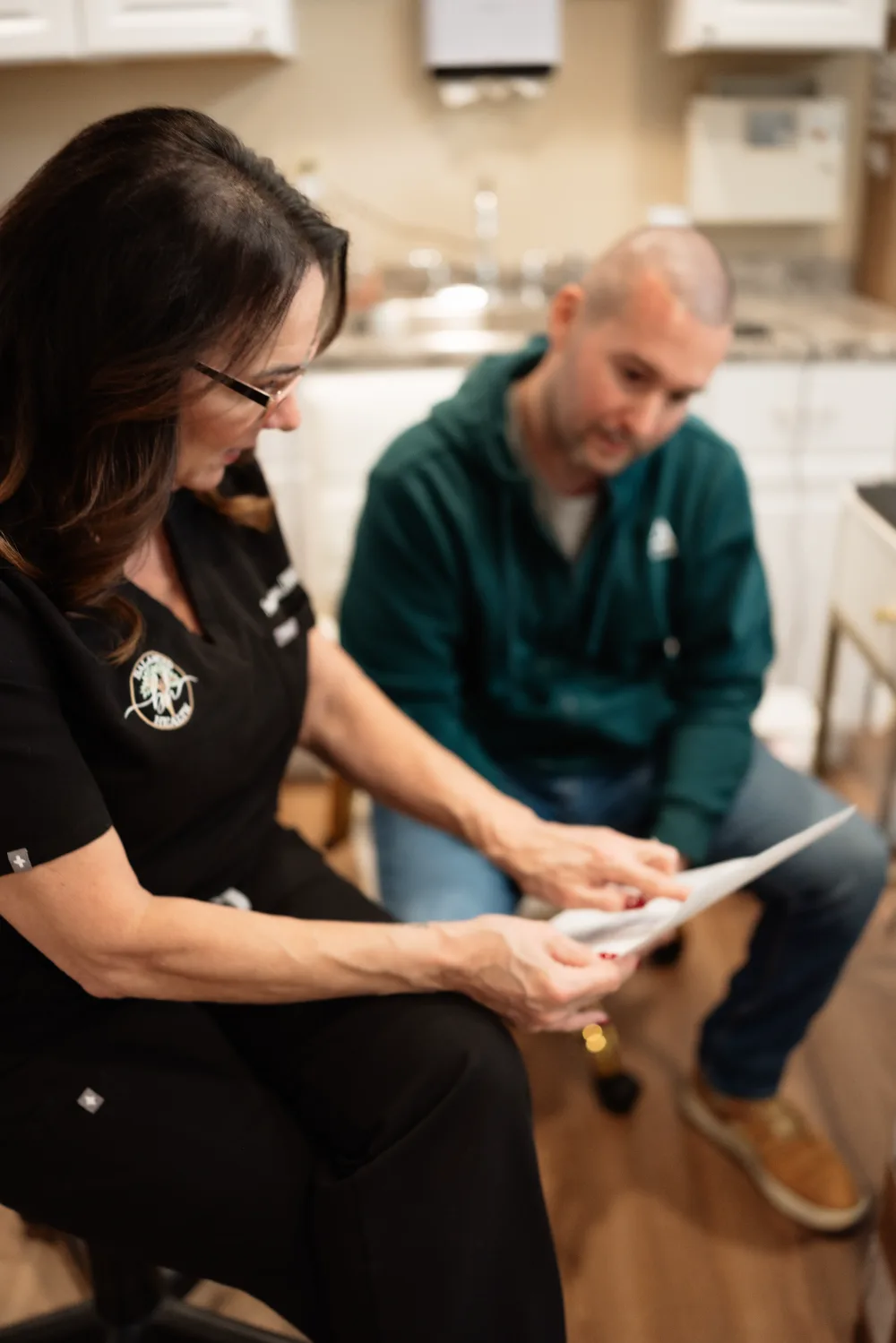 Provider meeting with a patient about weight loss