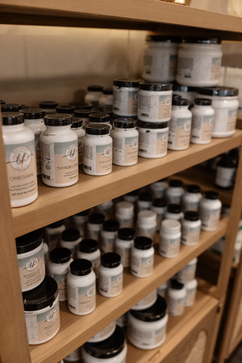 Team members with supplements at Balanced Health