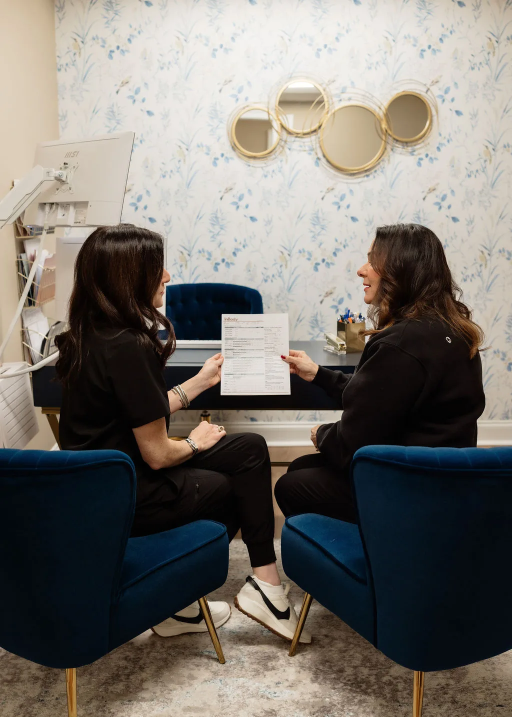 Provider meeting with a patient in the consult room