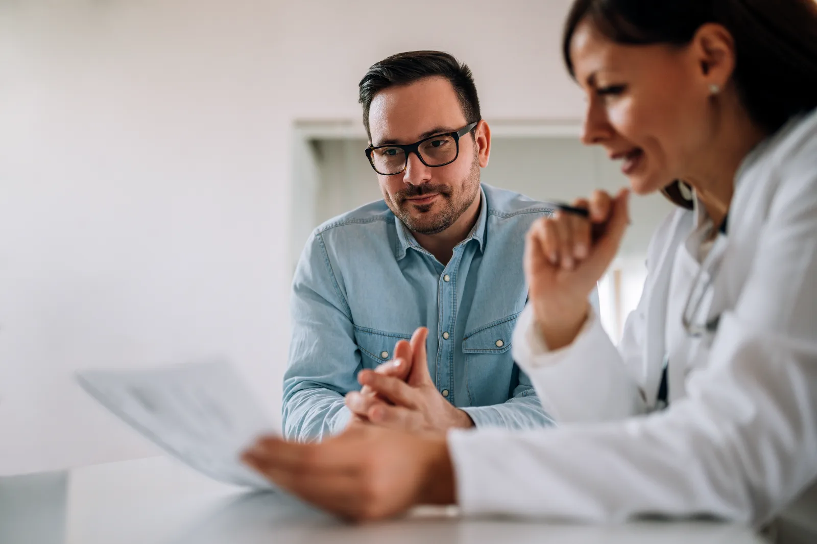 Provider meeting with a male patient