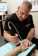 The StemWave device or applicator in use